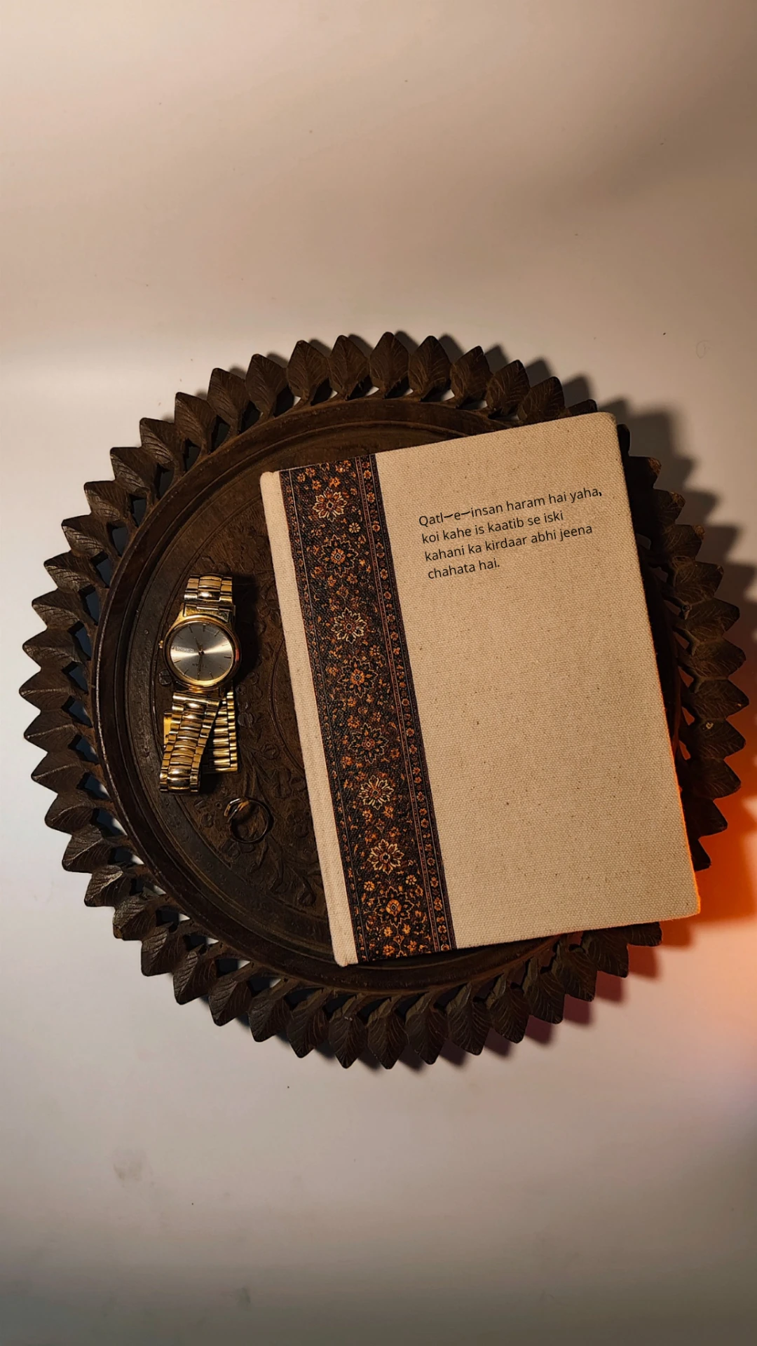 Kaatib diary with the English literary couplet on a carved wooden tray